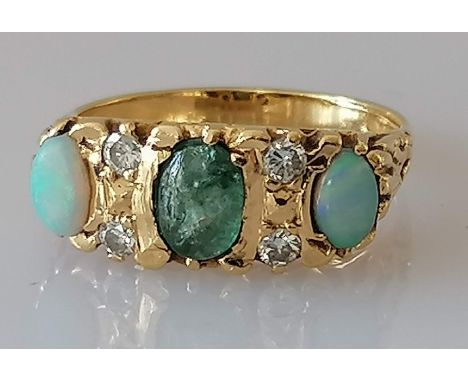 An Edwardian gold three-stone opal and diamond ring, size K, marks rubbed, tests for 14ct, 4.5g