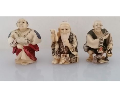 Three late 19th century Japanese carved ivory and polychrome painted netsuke figures, all signed, each 5cm high (3)