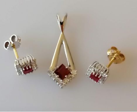 A 18ct white gold pendant with a princess-cut ruby and diamond decoration with similar white and yellow gold earrings, total 