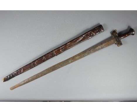 An Antique Straight Sword in Leather Scabbard; the sword with leather handle and pommel.&nbsp;