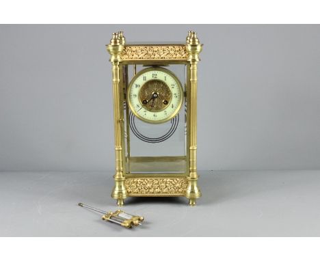 Antique Brass Mantel Clock, four bevelled glass panels revealing the movement and the mercury pendant, strikes to a coil, app