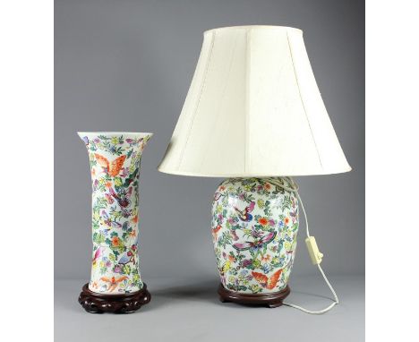 A 20th Century Chinese Famille Rose Lamp Base; the base profusely painted with butterflies and flowers, on a wooden base, app