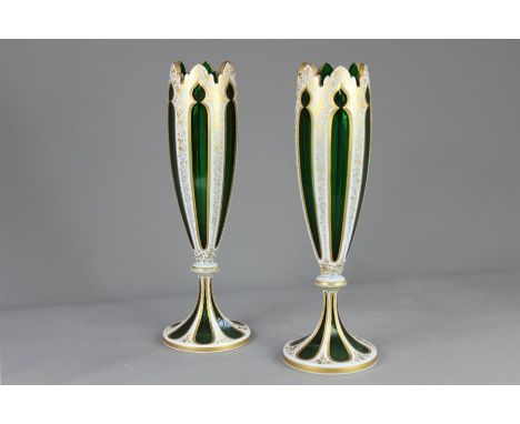 A Pair of Bohemian Green Glass and White Enamel Overlay Vases, approx 33 cms h.