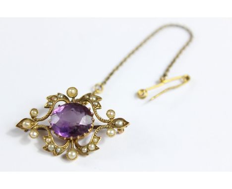 An Edwardian 15ct Amethyst and Seed Pearl Brooch. The brooch set with an amethyst, approx 12 x 10 mm, the brooch&nbsp;approx 