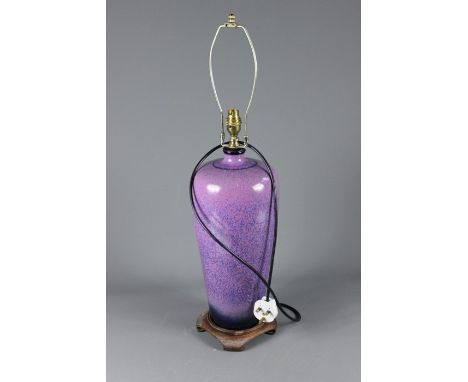 A Chinese Mauve-Glazed Ceramic Lamp Base, on a rosewood circular base, approx 45 cms.&nbsp;