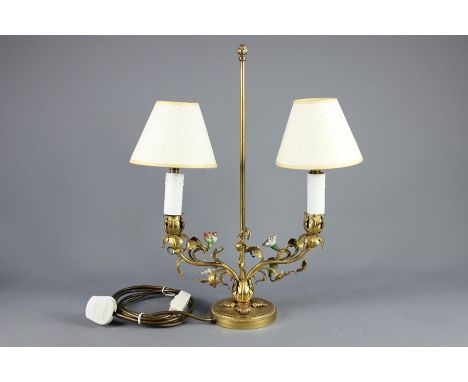 A French Gilt Brass and Porcelain Lamp, manufactured in Paris, the lamp base decorated with applied porcelain flowers.