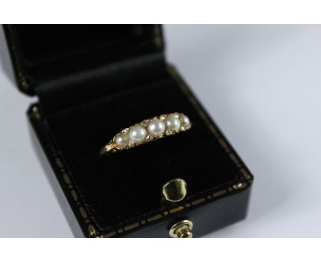 Antique 18ct Yellow Gold, Pearl and Diamond Ring; the ring set with five pearls, approx pts of dias, size P, approx 2.3 gms. 