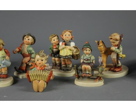 Quantity of West German Goebel and Hummel Figures. This lot includes eight figurines including Girl and Geese, Choir Boy, Gir