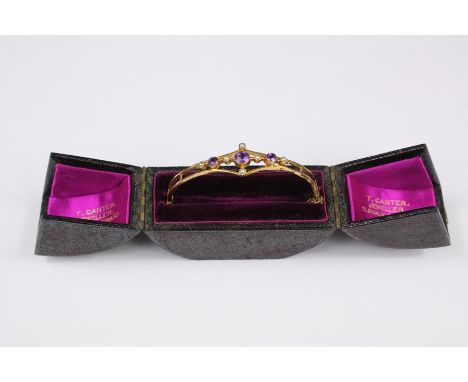 An Edwardian 14ct Gold Amethyst and Seed Pearl Bracelet, approx 60mm across, centre amethyst approx 5mm, flanked by two ameth