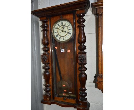 A VICTORIAN WALNUT VIENNA WALL CLOCK, enamel dial, Roman numerals (sd) (two weights and pendulum)