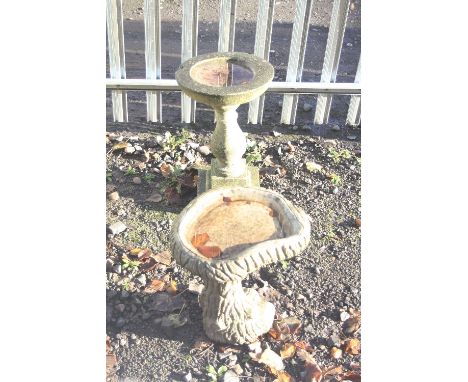 TWO VARIOUS COMPOSITE BIRD BATHS, one 60cm high x 35cm diameter, the other shaped in the form of a tree trunk, height 44cm