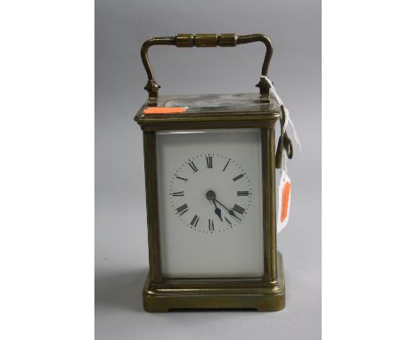 A BRASS CARRIAGE CLOCK, approximate height 12cm (key)