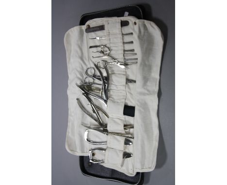 A SECOND HALF 20TH CENTURY CASE OF PODIATRY TOOLS, including scalpels, scissors, etc in a cloth sleeve (situated in Jewellery
