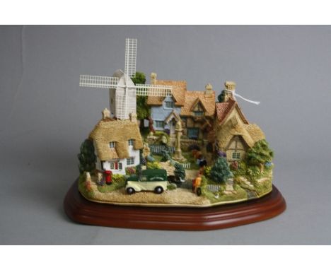 A BOXED LIMITED EDITION LILLIPUT LANE SCULPTURE 'The Village Green' L2558, 871/2500, with plinth and certificate