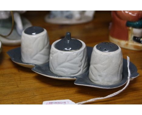 A CARLTONWARE CRUET SET AND STAND, leaf shape