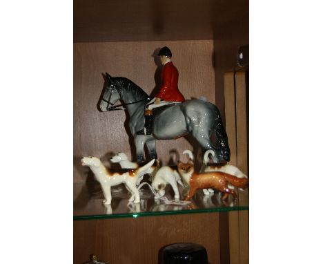 FOUR BESWICK FOX HOUNDS, No 941, No 942 (back leg and tail loose), No 943 and No 944 and a Beswick Fox No 1440, together with