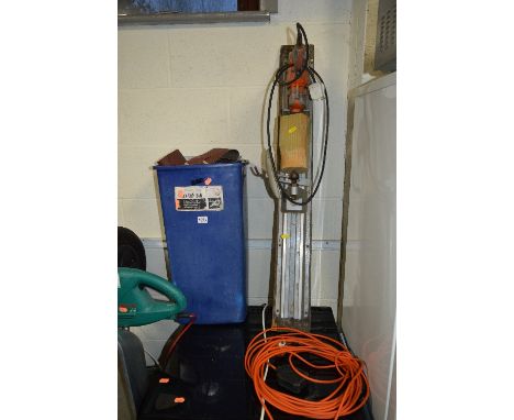 A WHEELBARROW, bin of tools and consumables, a Flymo mower, Bosch Hedge trimmer and a garden blower etc (7)