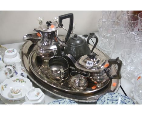 A THREE PIECE PLATED TEA SERVICE, TWO TRAYS, and other plated/pewter wares (9)