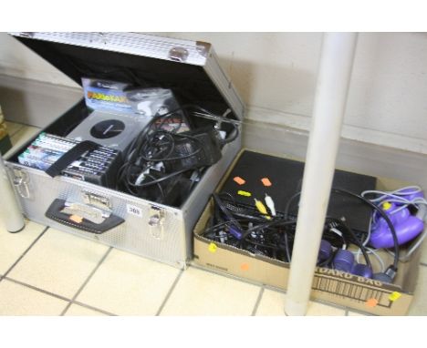 A NINTENDO GAMECUBE, with games, in a case, together with a playstation2 console