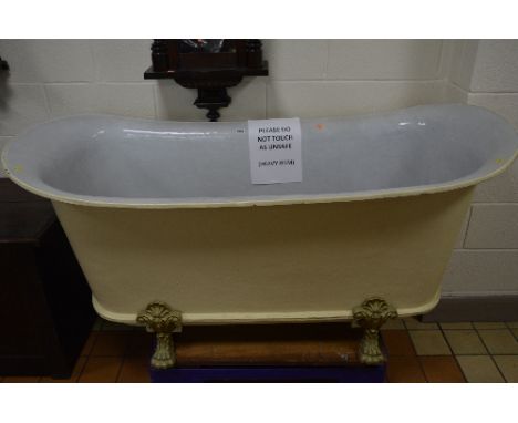 A LATE 19TH CENTURY FRENCH CAST IRON BATEAU BATH, by Rogeat & Cie of Lyon, (No 7), white enamel interior, on four short cabri