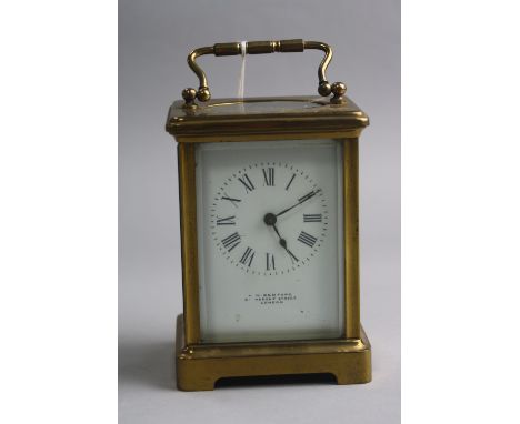 A BRASS CARRIAGE CLOCK, 'H.W Bedford London', approximate height 11cm