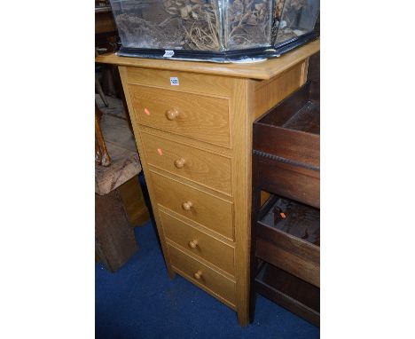 A TALL MARKS AND SPENCER LIGHT OAK CHEST, of five drawers