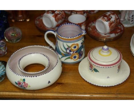 THREE PIECES POOLE POTTERY, to include jug, height 9cm, crocus ring and covered butter dish (lid chipped) (3)