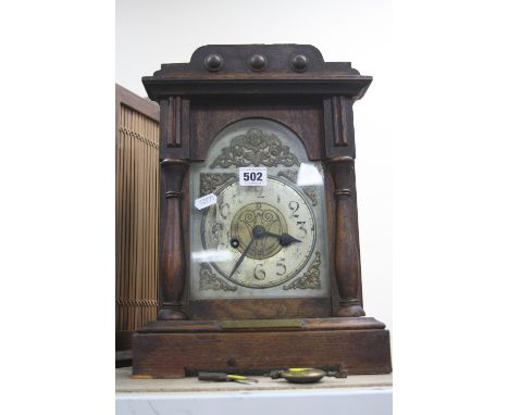 A BRACKET CLOCK, early 20th century, with presentation plaque from Metropolitan Police 1919, face and numbers rubbed, key and