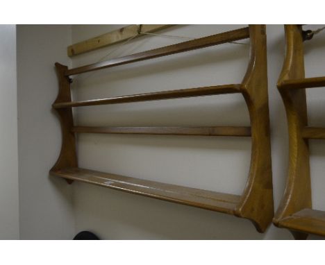 AN ERCOL ELM TWO TIER HANGING PLATE RACK