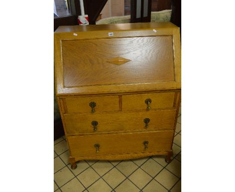 A LIGHT OAK FALL FRONT WRITING BUREAU, with fitted interior containing ten various drawers above four exterior drawers, appro