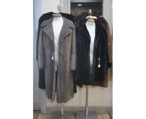 A SHEEPSKIN COAT, marked size 40 and 'K & M' label, a suede coat, with a simulated fur jacket with label 'Tissavel' and anoth