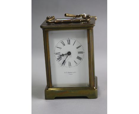 A BRASS CARRIAGE CLOCK, 'E.C. Kemp & Co Paris', approximate height 10.5cm (key)