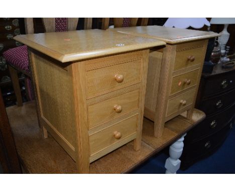 A PAIR OF MARKS AND SPENCER LIGHT OAK THREE DRAWER BEDSIDE CHESTS