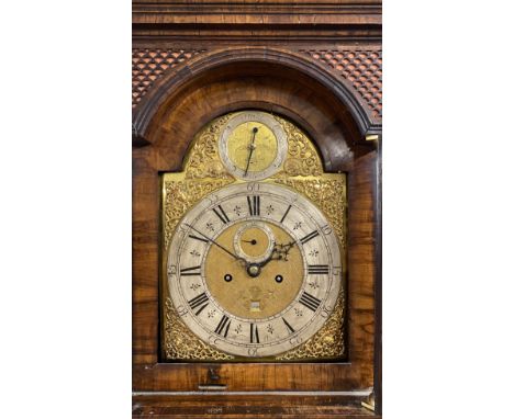 AN EARLY 18TH CENTURY WALNUT AND FEATHER BANDED LONGCASE CLOCK, the hood with caddy top and pierced gilt metal side grilles, 