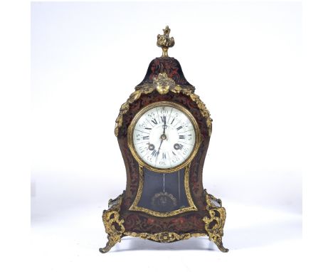 A 19TH CENTURY RED TORTOISESHELL AND BOULLEWORK MANTEL CLOCK of balloon shape with gilt metal mounts, the white enamel dial i