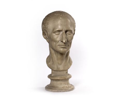 AFTER THE ANTIQUE A PLASTER PORTRAIT BUST OF JULIUS CEASAR, indistinctly signed, 49cm high