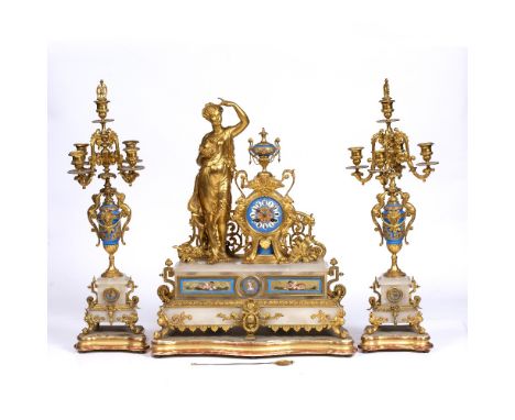 A 19TH CENTURY FRENCH CLOCK GARNITURE DE CHEMINÉE the ornate gilt metal case with porcelain Roman dial, Japy twin train movem