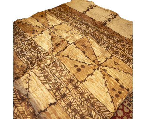A LARGE OLD TONGAN TAPA CLOTH decorated with geometric and foliate patterns on squares on a light brown ground 420 x 184cm 