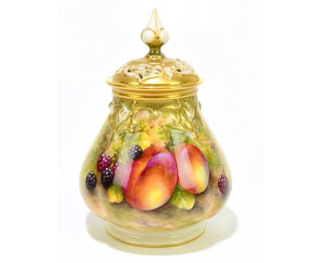 E. TOWNSEND FOR ROYAL WORCESTER; a potpourri pot with cover, decorated with fruits, height 17cm.Condition Report: Good condit