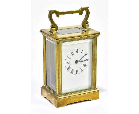 A brass carriage clock, the dial set with Roman numerals, height 11cm.