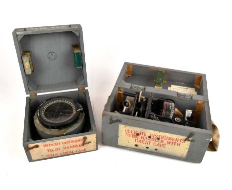 A cased Astro compass MKII, together with further cased compass.