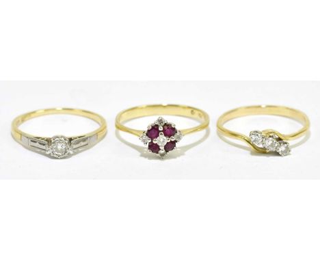 An 18ct yellow gold ruby and diamond set ring, size Q, together with an 9ct yellow gold single stone ring, size Q, also a yel