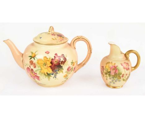 ROYAL WORCESTER; a blush ivory teapot, together with a small jug, both floral decorated.Condition Report: Crack to the interi