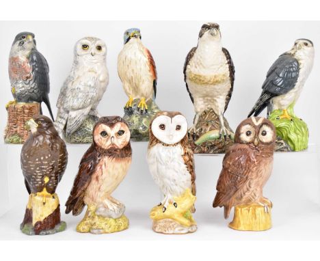 WHYTE &amp; MACKAY, SCOTCH WHISKY; nine collectible pottery bird decanters, six examples with contents, comprising 'Peregrine