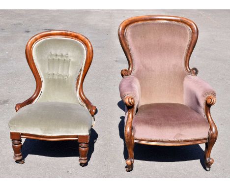 A Victorian nursing chair upholstered in a salmon pink material, on turned column supports, together with a similar smaller l