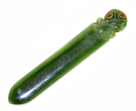 A Maori nephrite jade paper knife decorated with a tiki, length 12cm.Condition Report: Tiny chip to the tiki head that appear