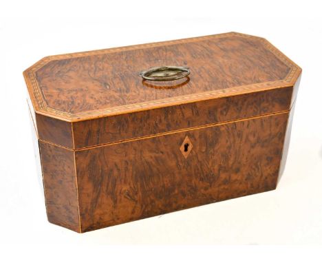 A 19th century yew wood, burr yew, and inlaid tea caddy of rectangular form with cantered corners, enclosing two lidded caddi