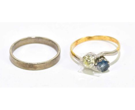 A yellow metal diamond and sapphire crossover dress ring, approx size R 1/2, 3.5g (diamond loose in setting), with an unmarke