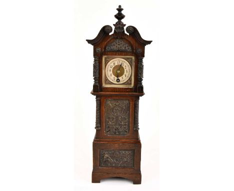 A miniature oak cased longcase clock, the dial set with Arabic numerals, with two carved panels to the front, height 42cm.