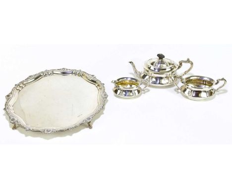 T WILKINSON &amp; SONS; a late Victorian hallmarked silver three piece tea service of oval form with panelled bodies, Birming